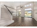Open-concept home featuring a staircase and views of the backyard and pool at 7439 E Beryl Ave, Scottsdale, AZ 85258