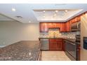 This modern kitchen features stainless steel appliances and beautiful granite countertops at 7970 E Camelback Rd # 604, Scottsdale, AZ 85251