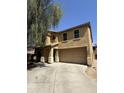 Two-story home featuring stucco siding, a tile roof, and a two-car garage at 9456 W Jamestown Rd, Phoenix, AZ 85037