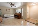 Cozy living room featuring tile floors, natural light, and comfortable seating at 10601 N 36Th St, Phoenix, AZ 85028