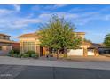 This charming single-Gathering home features a two-car garage, lovely landscaping, and stone accents at 16401 S 29Th Ave, Phoenix, AZ 85045