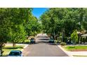 Tree-lined street view with well-maintained lawns and parked cars in a quiet neighborhood at 1839 E Palo Verde Dr, Phoenix, AZ 85016