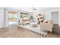 Open floorplan offers tile floors, neutral paint, recessed lighting and sliding glass doors to the backyard at 19319 E Thornton Rd, Queen Creek, AZ 85142