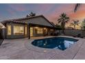 Beautiful backyard pool with stamped concrete and a covered patio at 19651 N 34Th St, Phoenix, AZ 85050
