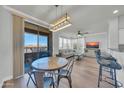Open floor plan featuring dining area, living room, and balcony with a scenic view at 20100 N 78Th Pl # 3103, Scottsdale, AZ 85255