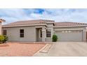 Charming single-story home with a tile roof, desert landscaping, and a two-car garage at 2326 E Spruce Dr, Chandler, AZ 85286