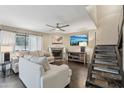 Bright living room features a fireplace, large sliding glass doors, and comfortable furnishings at 3030 N Hayden Rd # 28, Scottsdale, AZ 85251