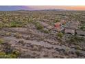 Expansive aerial view of home and neighborhood in a desert community at 31705 N 128Th Dr, Peoria, AZ 85383