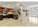 Open kitchen area flows into a spacious living area with stainless appliances and natural light at 33 W Missouri Ave # 17, Phoenix, AZ 85013