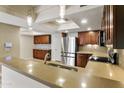 Modern kitchen features stainless steel appliances, sleek countertops, and wood cabinetry at 33 W Missouri Ave # 17, Phoenix, AZ 85013