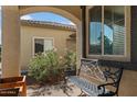 Cozy front patio area featuring a comfortable bench, perfect for enjoying the outdoor ambiance at 3936 E Narrowleaf Dr, Gilbert, AZ 85298