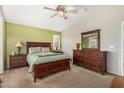Comfortable main bedroom with wooden furniture set and large window for natural light at 7003 S 23Rd Ln, Phoenix, AZ 85041