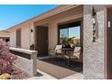 Cozy front porch featuring seating with chairs, creating a welcoming outdoor space at home at 772 Leisure World --, Mesa, AZ 85206