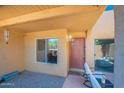 Welcoming front entrance featuring covered patio, 'yay! you're here!' door mat, and shade at 8414 N Central Ave # C, Phoenix, AZ 85020