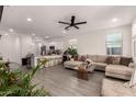 Inviting living room with an open-concept design, neutral colors, and tile floors, perfect for entertaining at 12505 W Kaler Dr, Glendale, AZ 85307