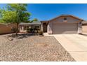 Charming single-story home features low-maintenance landscaping and attached two car garage at 1376 E Rosemary Trl, Casa Grande, AZ 85122