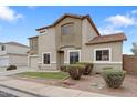 Charming two-story home featuring desert landscaping, neutral stucco, and a tile roof at 1410 S Boulder St # A, Gilbert, AZ 85296