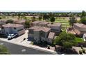 Two-story home featuring a well-manicured lawn and a view of the community golf course at 1410 S Boulder St # A, Gilbert, AZ 85296