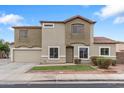 Charming two-story home featuring desert landscaping, neutral stucco, and a tile roof at 1410 S Boulder St # A, Gilbert, AZ 85296