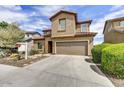 Charming two-story home with a private two-car garage and desert landscaping at 1854 W Fetlock Trl, Phoenix, AZ 85085