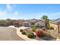 An aerial view of the exterior showing desert landscaping and nearby homes in the neighborhood at 20082 N 272Nd Ln, Buckeye, AZ 85396