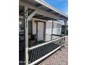 Charming front porch with bench seating and decorative railing at 2011 N 26Th Cir, Mesa, AZ 85213