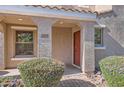 Covered front porch with neutral decor, brick pavers and well manicured landscaping at 2862 E Megan St, Gilbert, AZ 85295