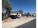 Charming single-story home with desert landscaping, a driveway, and a two-car garage at 2981 S 257Th Ave, Buckeye, AZ 85326