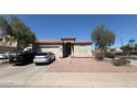 Single-story home with a two-car garage, complemented by desert landscaping at 2981 S 257Th Ave, Buckeye, AZ 85326