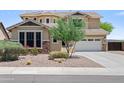 Charming single-Gathering home showcases desert landscaping with mature trees and a spacious driveway at 31221 N 130Th Ln, Peoria, AZ 85383