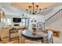 Open-concept dining area flowing into the living room, perfect for entertaining guests at 6131 N 28Th Pl, Phoenix, AZ 85016
