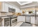 Well-equipped kitchen with stainless steel appliances and white cabinetry at 6131 N 28Th Pl, Phoenix, AZ 85016