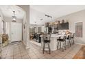 Open-concept kitchen with island and bar seating, perfect for entertaining and casual dining at 6939 S Red Hills Rd, Gold Canyon, AZ 85118