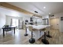 Bright, modern kitchen with a large center island, stainless steel appliances, and wood-look flooring at 7201 N 16Th Dr, Phoenix, AZ 85021