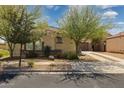 Quaint exterior view with desert landscaping highlighting the home's cozy curb appeal and charming architectural details at 897 E Cherry Hills Dr, Chandler, AZ 85249