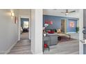 Inviting living space showcasing modern flooring, neutral walls, and seamless flow to other areas of the home at 897 E Cherry Hills Dr, Chandler, AZ 85249