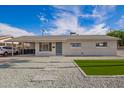 Well-maintained single-story home with low-maintenance desert landscaping at 143 W Ray Rd, Chandler, AZ 85225