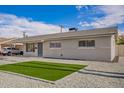 Inviting single-story home with desert-style landscaping and a covered parking area at 143 W Ray Rd, Chandler, AZ 85225