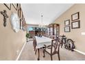 Formal dining room with chandelier, carpet, and an abundance of natural light at 15226 N 51St St, Scottsdale, AZ 85254