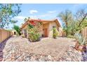 Cozy home featuring a quaint courtyard with brick pavers and lush bougainvillea at 15226 N 51St St, Scottsdale, AZ 85254