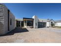 Modern home with stone accents, a glass garage door, and a contemporary design at 1538 W Wagon Wheel Dr, Phoenix, AZ 85021