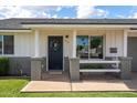 Inviting front porch with decorative wreath and charming accents, offering a warm welcome at 2418 E Hermosa Dr, Tempe, AZ 85282