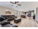 Open-concept living room featuring tile floors, lots of natural light, and dining area at 24229 W Tonto St, Buckeye, AZ 85326