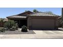 Charming single-Gathering home with a well-maintained front yard, desert landscaping, and a two-car garage at 30178 N Coral Bean Dr, San Tan Valley, AZ 85143