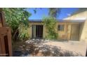 A view of the backyard featuring a covered patio and landscaping at 3404 W Tangerine Ln, Phoenix, AZ 85051