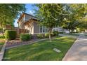 Well-maintained home with landscaped front yard and mature trees, offering a serene neighborhood setting at 3822 E Amber Ln, Gilbert, AZ 85296