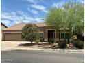 Charming one-story home with well-manicured landscaping and a cozy front entrance at 725 S Canfield --, Mesa, AZ 85208