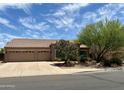 Lovely single story home featuring a three-car garage, mature trees, and desert landscaping at 725 S Canfield --, Mesa, AZ 85208