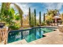The inground pool with desert landscaping is perfect for enjoying the Arizona sun and outdoor living at 725 S Canfield --, Mesa, AZ 85208