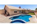 Inviting backyard pool with a built-in spa and covered patio at 8500 W Saint John Rd, Peoria, AZ 85382